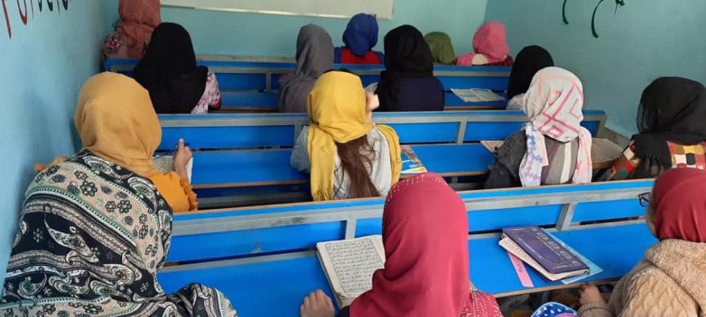 Women learning sewing skills